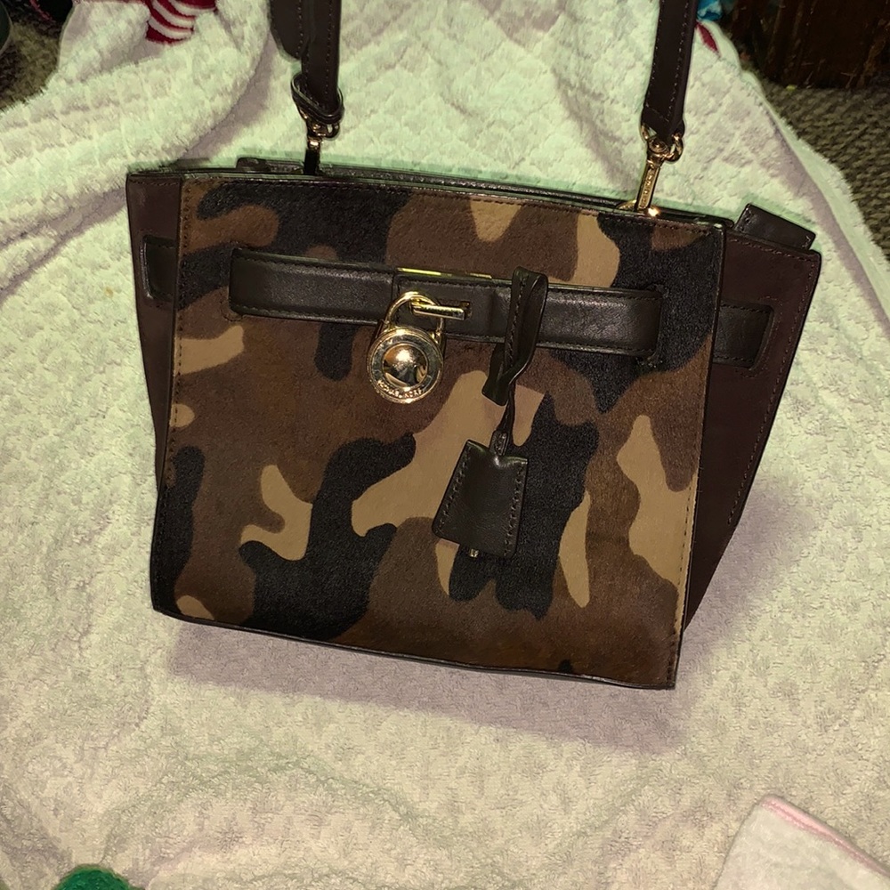 Micheal Kors camo purse. Practically brand new. Only Used twice.